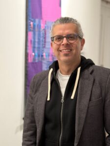 Photo of man smiling at camera.